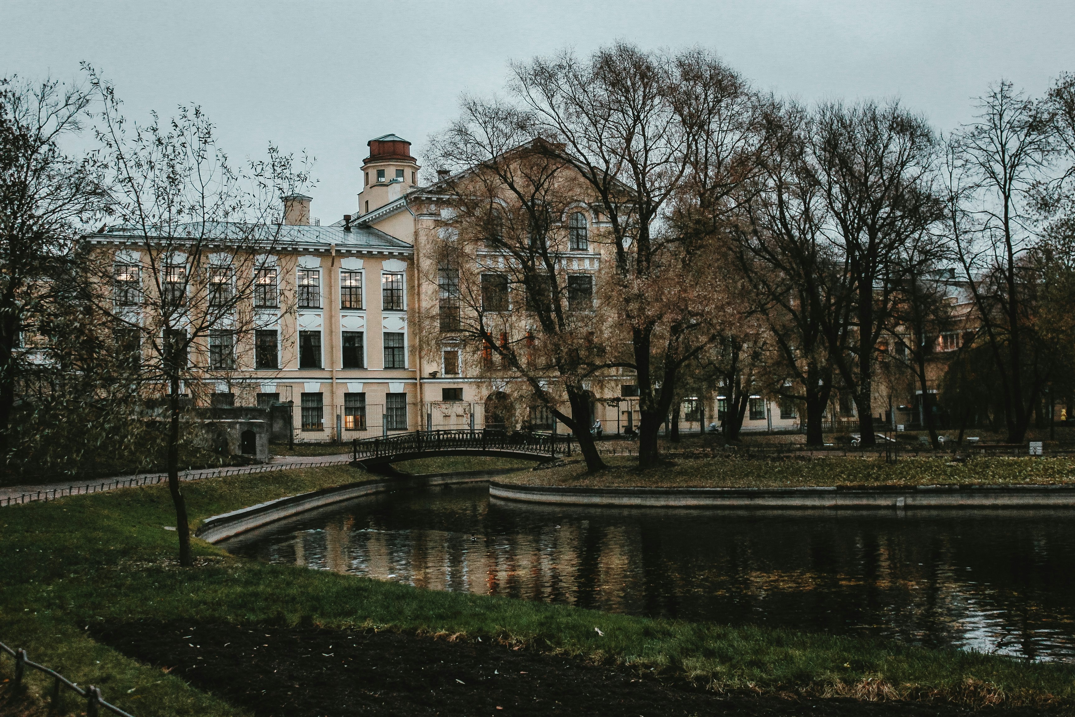 brown concrete building near body of water during daytime